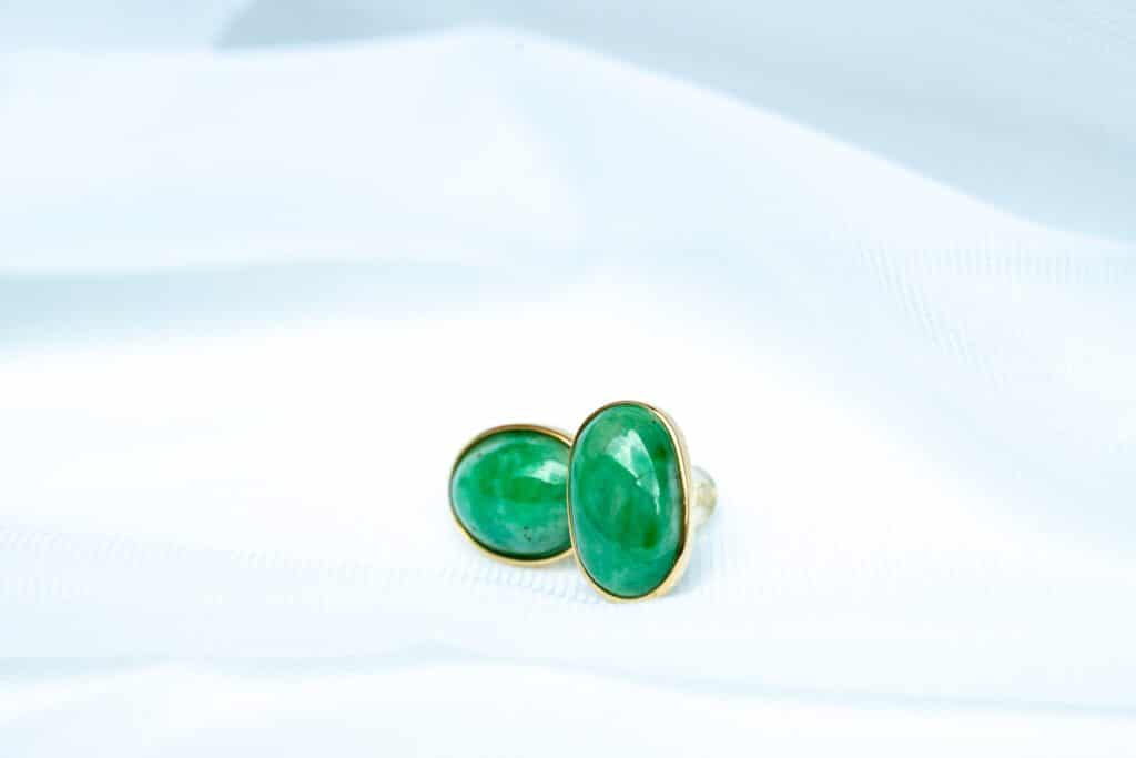 a pair of green and black dice