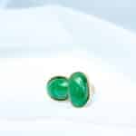 a pair of green and black dice