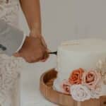 person holding pink rose bouquet
