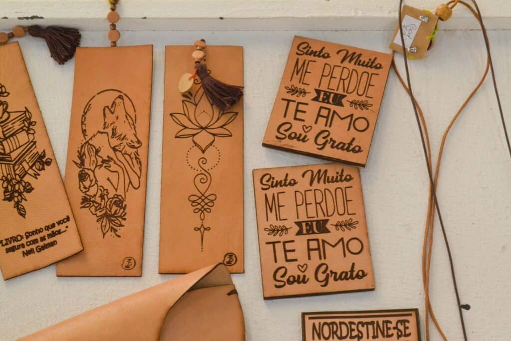 Leather bookmarks with intricate designs and text