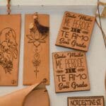 Leather bookmarks with intricate designs and text
