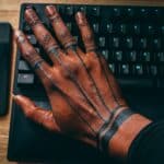 man with hand tattoo