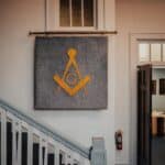 Masonic symbol banner hanging on wall