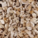 sliced fresh mushrooms in a pot