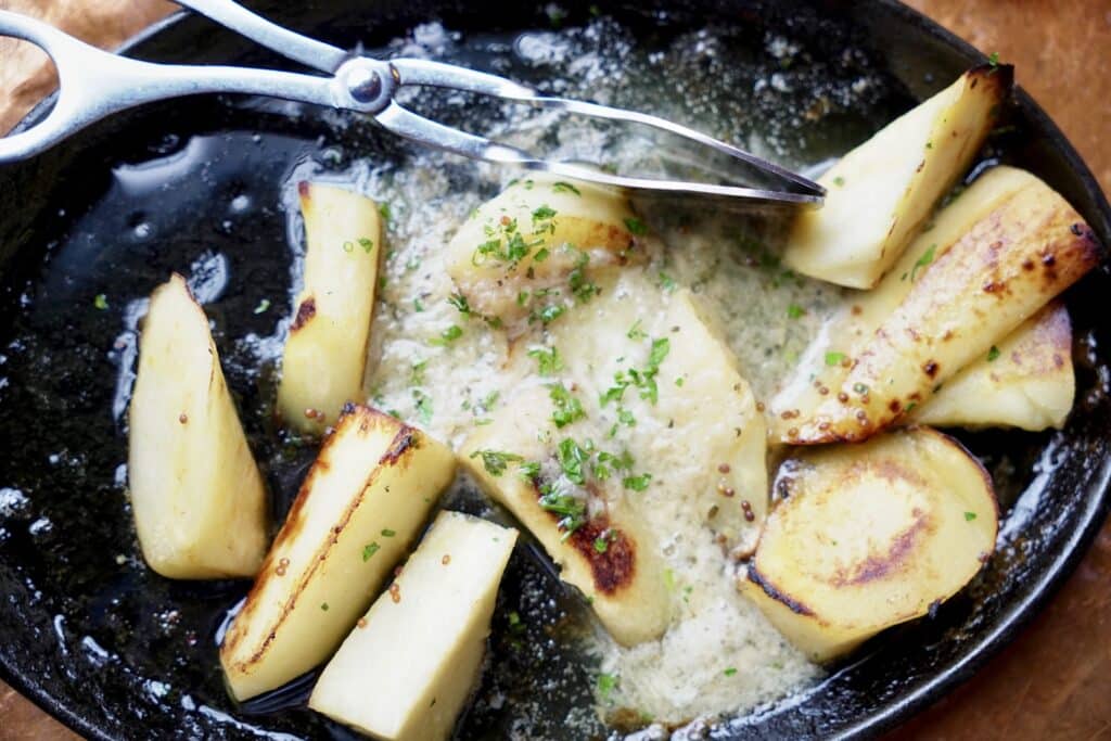 Roasted parsnips in a creamy sauce with herbs