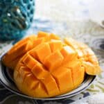 a close up of a plate of fruit on a table