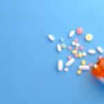 orange and white medication pill