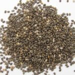 a pile of seeds on a white surface