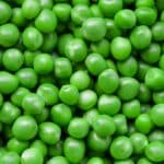 full plate of green beans on the white desk